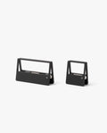Two modern, minimalist black staple removers in different sizes sit side by side on a plain white background—a sleek addition to any desk organizer paired with your HMM Clips (Set of 2 - Black).