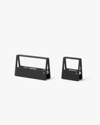 Two modern, minimalist black staple removers in different sizes sit side by side on a plain white background—a sleek addition to any desk organizer paired with your HMM Clips (Set of 2 - Black).
