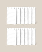Two rows of white Discbound Analog Refill (12-pack) notepads with checklist designs and checkboxes are neatly arranged against a beige background—ideal for use with Analog Cards or as refills for your Discbound Analog system.