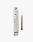 A Black Gel Pen Refill (The Ugmonk Pen) is displayed next to its white packaging. The 0.5mm metallic refill has a black end, and the box shows product details in black text along with an illustration of the refill.