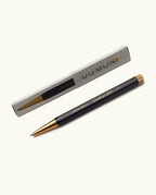 The Ugmonk Pen (Leuchtturm1917 Drehgriffel - Black) is shown alongside its gray and gold "UGMONK" box, both arranged neatly on a plain white background.