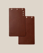 The *Covers Only* – Leather Discbound Analog (Brown) set includes two brown full-grain leather covers, made in the USA, with rounded corners and three top holes—one embossed with "Discbound Analog," one with a small logo—against a beige background.