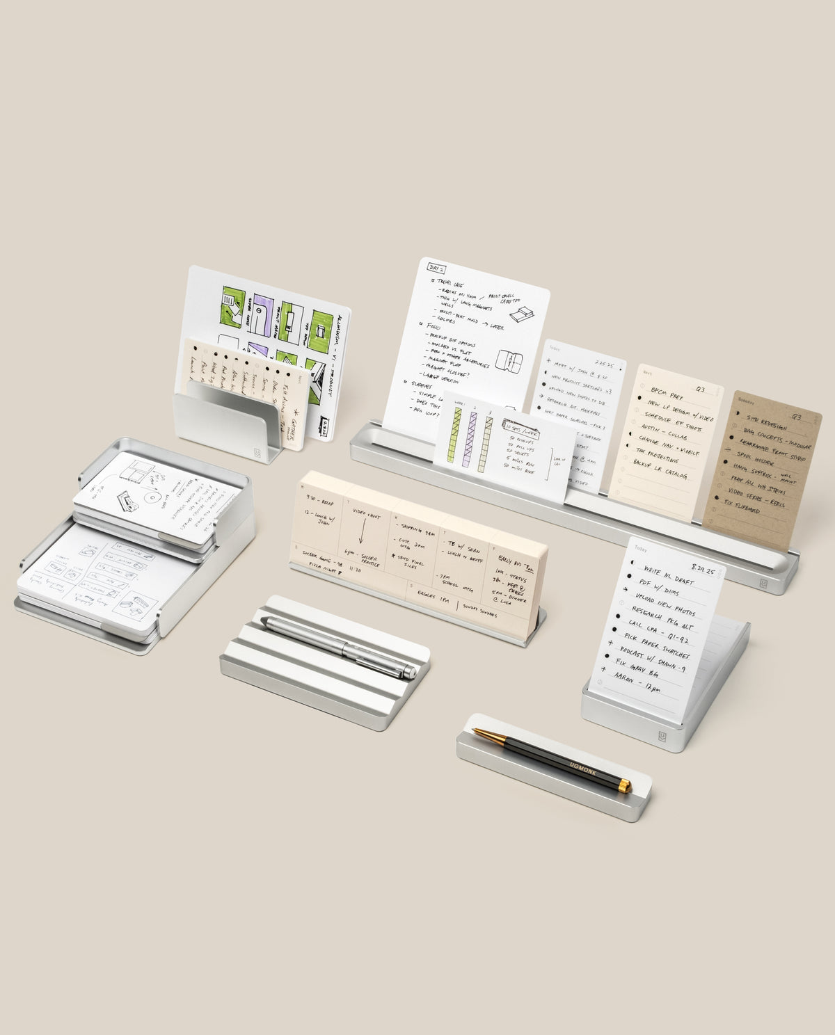 The Complete Analog Collection (Silver Aluminum) features minimalist desk accessories—organizer, card holders, and stands for notecards and pens—neatly arranged on a beige background.