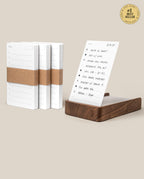 The Analog Daily Focus Kit + 3 Refills (Walnut) features three notepad stacks with brown paper bands and a walnut card holder displaying a daily sheet on a beige background. #1 Best Seller—your ideal analog productivity system.