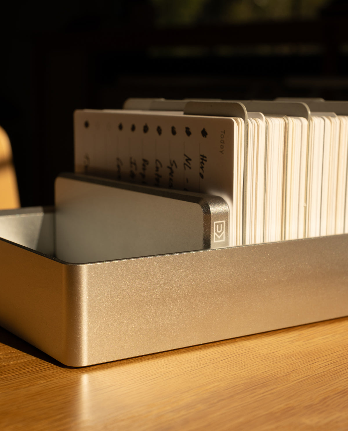 An Analog Archive (Silver Aluminum) card holder containing a stack of indexed cards.