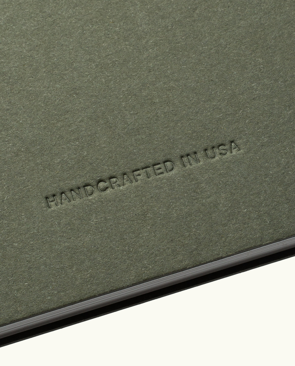 The Discbound Journal Bundle features a textured olive-green cover embossed with "HANDCRAFTED IN USA" in uppercase, ideal for your refillable 6"x8.5" journal and three dot grid paper refills.