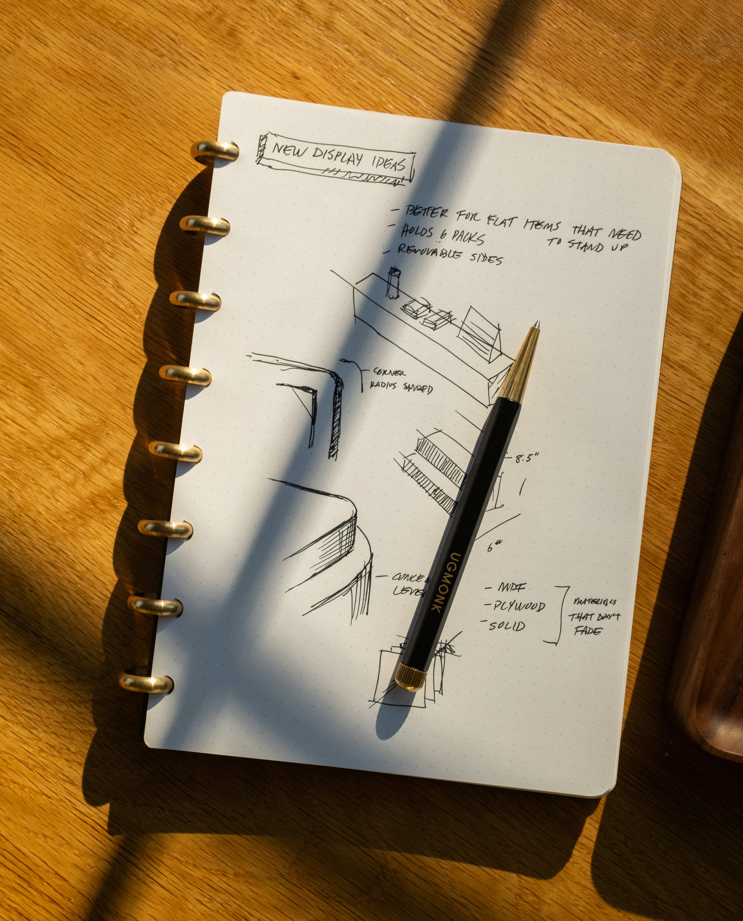 The Discbound Journal (Standard 6"x 8.5") is a refillable notebook with a pen, featuring solid brass discs for a sleek and durable discbound design.