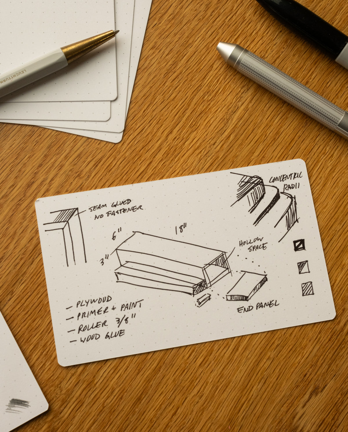 The Analog Dot Grid Cards - Small (3-Pack) are perfect for note taking and sketches. Each 3x5 card features a dot grid, ideal for diagrams or details, and fits easily alongside your favorite pens on any desk or workspace.
