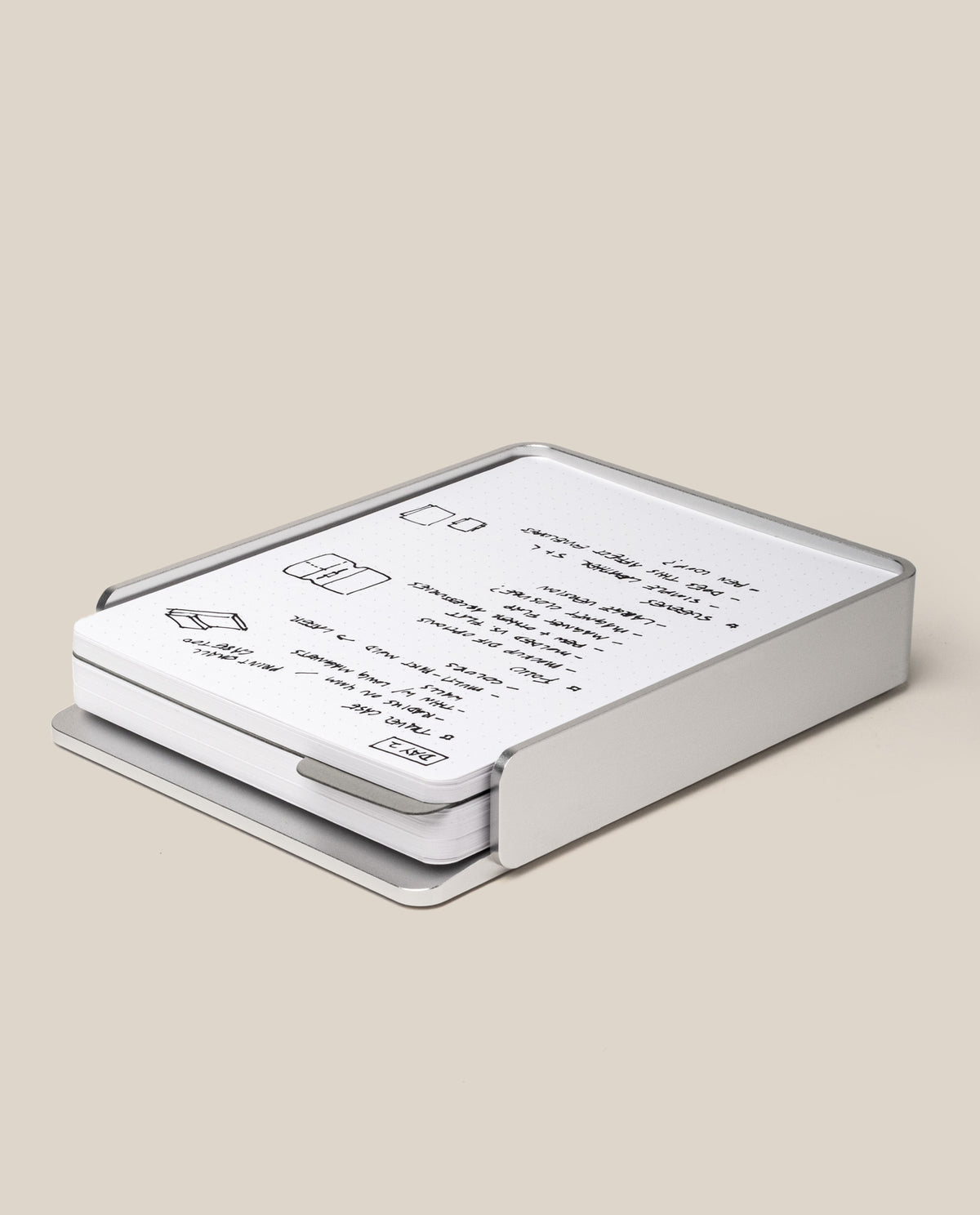 The Analog Capture Kit - Large (Silver Aluminum) features a sleek, rectangular aluminum tray with an open side revealing white cards printed with minimal black text and simple line drawings, all set against a plain beige background.