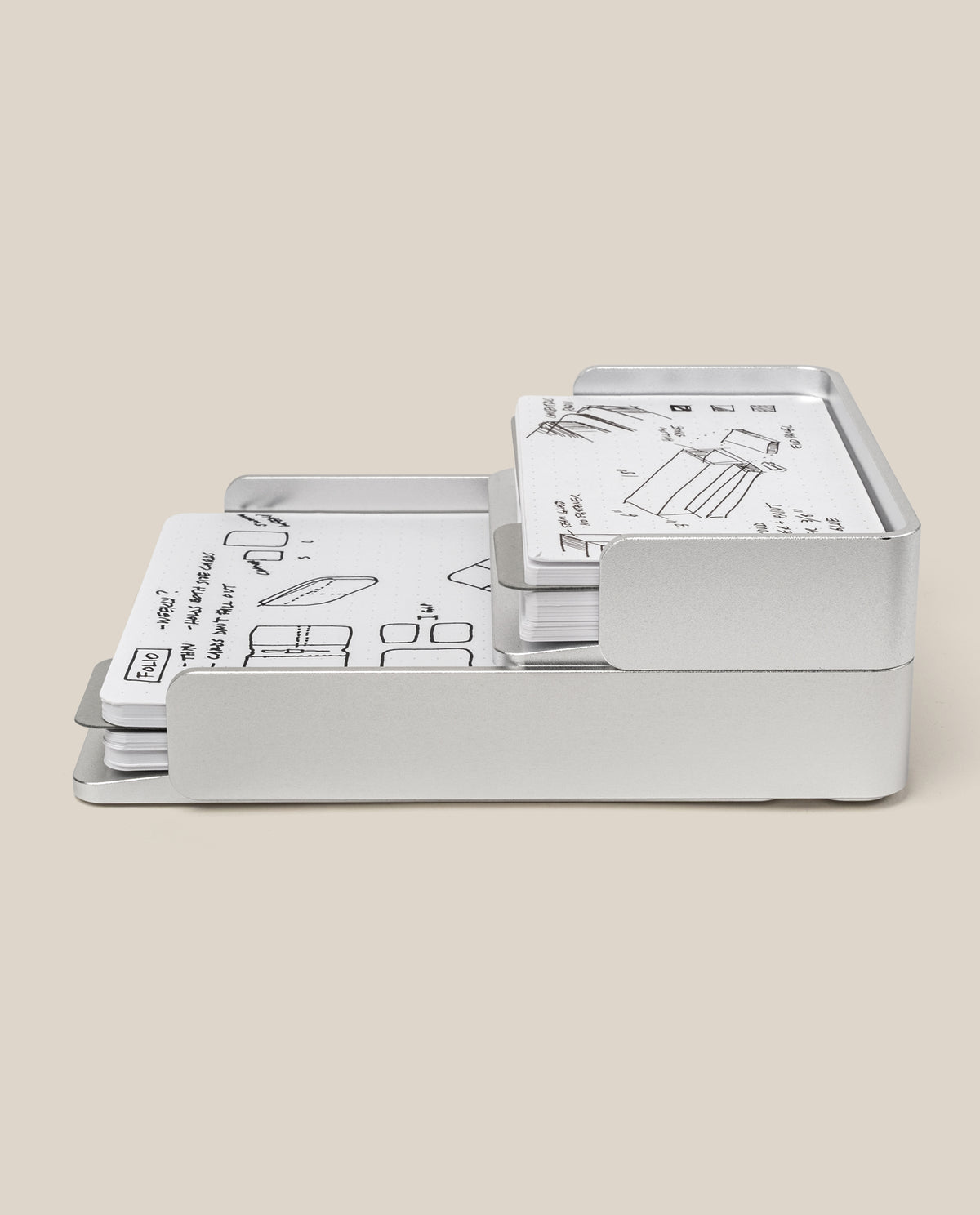 The Complete Analog Collection (Silver Aluminum) organizes several white cards with black hand-drawn sketches and notes, all displayed against a plain beige background.