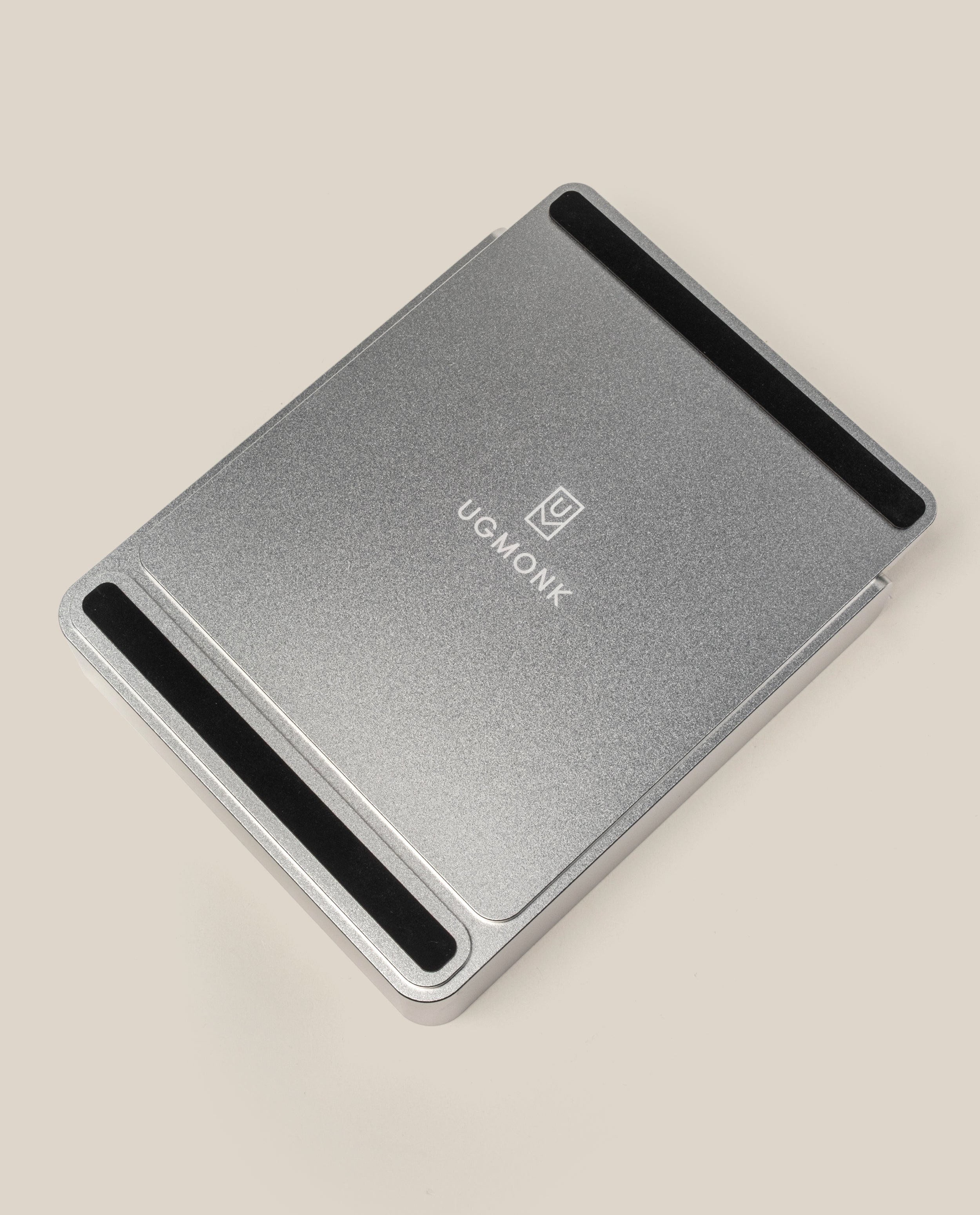 The Analog Capture Kit - Small & Large (Silver Aluminum) is a rectangular metal laptop stand with black non-slip strips at both ends and the UGMONK logo centered, matching the minimalist Dot Grid Cards, shown on a plain beige background.