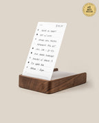 The Analog Daily Focus Kit (Walnut) holds a handwritten to-do list card with bullet-pointed tasks for elegant, analog productivity. A gold #1 Best Seller badge appears in the top right on a beige background.