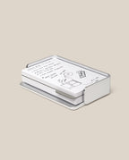 The Analog Capture Kit - Small (Silver Aluminum) features white dot grid cards with black handwritten notes and drawings, neatly arranged in a sleek silver aluminum tray on a plain beige background.