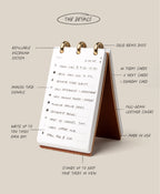 A compact, standing flip notepad—Leather Discbound Analog + 3 Refills (Tan)—features handwritten task lists, elegant gold rings, and a premium tan full-grain leather cover. Handwritten labels highlight details such as refillable pages, solid brass discs for the unique Discbound Analog system, and its luxurious full-grain leather construction.