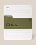 A stack of Analog Task Cards - Large made from uncoated cardstock, held by an olive green band, features checkboxes and lines for jotting tasks or ideas. The visible card is labeled “Today” and rests on a neutral background.
