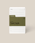 A stack of Analog Task Cards - Small with a minimalist design, made from uncoated 3x5" 100lb cardstock, includes spaces for tasks and a green label showing 33 cards.
