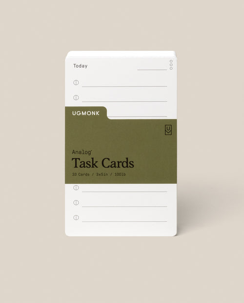 A stack of Analog Task Cards - Small with a minimalist design, made from uncoated 3x5" 100lb cardstock, includes spaces for tasks and a green label showing 33 cards.