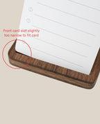 A walnut Analog Travel Case from our warehouse sale is shown with a paper card inserted; a red circle emphasizes the front card slot, which is slightly too narrow for the card to fit properly—perfect for discovering unique finds in our collection.