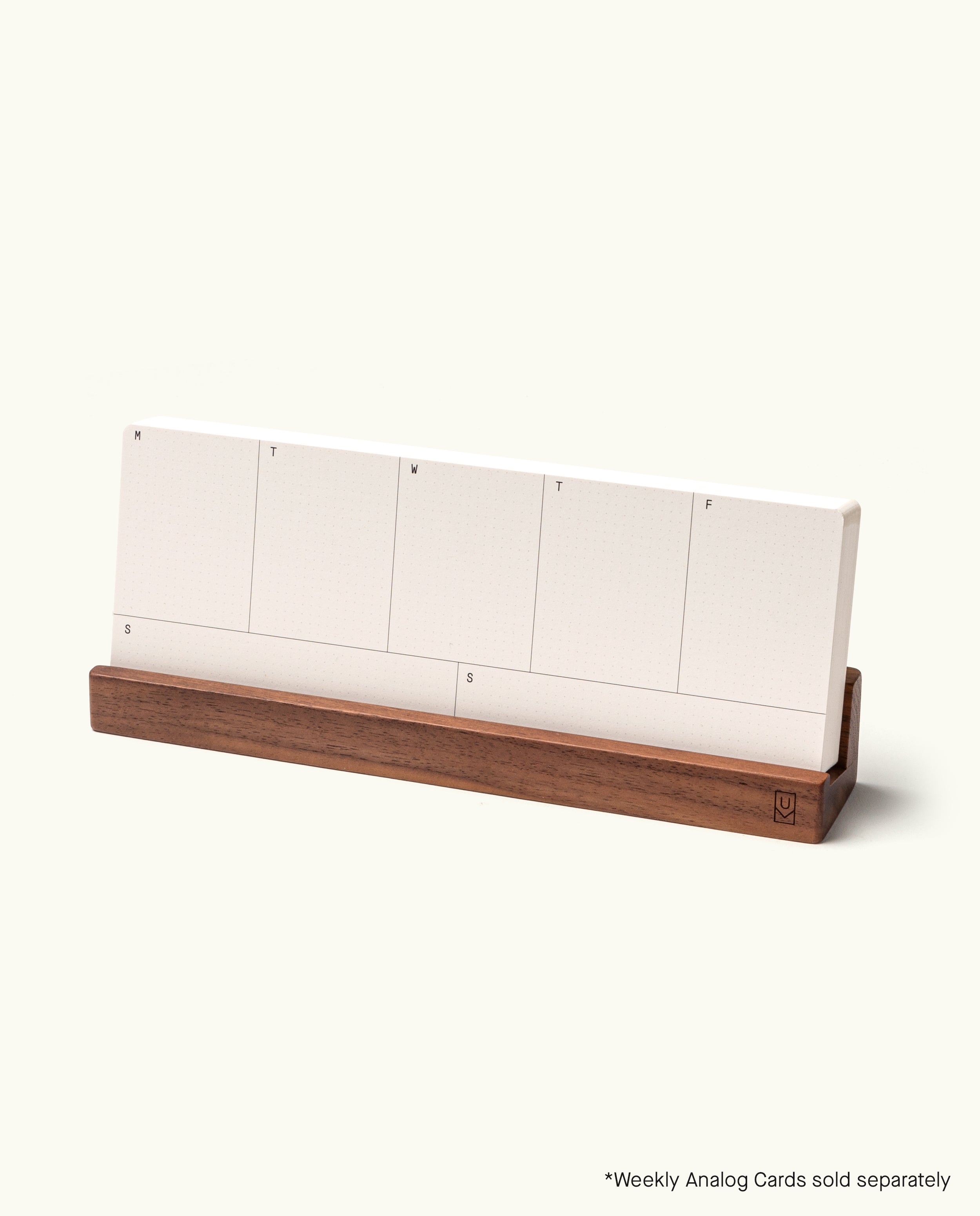 The Analog Weekly Card Holder (Walnut), handcrafted in Pennsylvania, displays blank white cards labeled with days of the week. “*Weekly Analog Cards sold separately” appears in the corner.