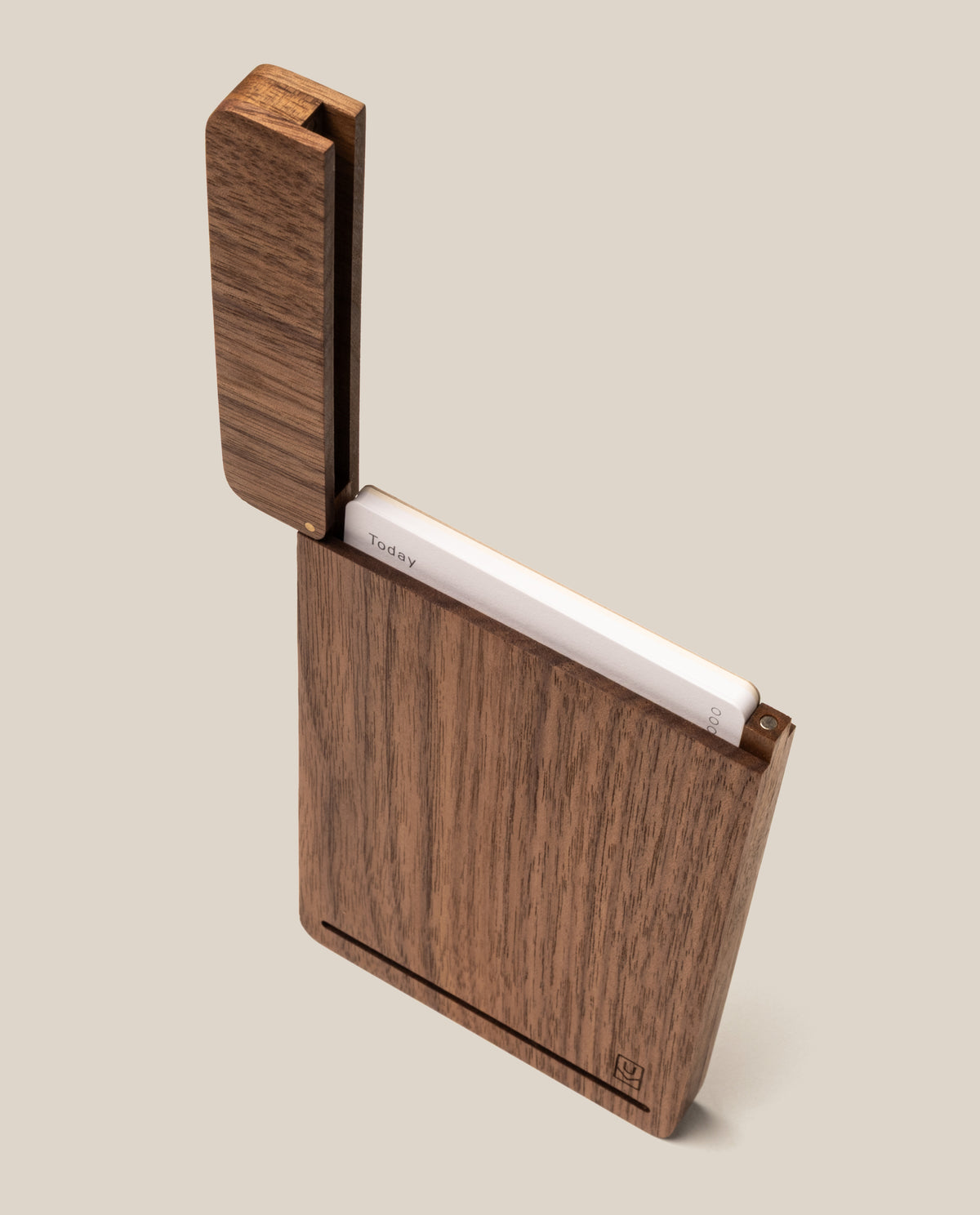 The Analog Travel Case + 3 Card Packs (Walnut) is shown partially open, displaying a stack of white task cards inside its premium walnut case with a hinged lid. The holder features a simple, modern design and rests against a plain beige background.