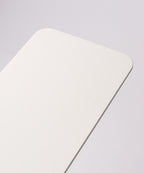 A close-up of the corner of the Gather 1x4 Base Plate (White), a rectangular object with a textured powder-coated steel surface, set against a plain light background.