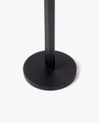 A close-up of the HMM Scissors (Black) shows its black, round magnetic metal base with a vertical pole at the center, set against a plain white background.