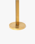 Close-up of the base and lower stem of a gold-colored metal object, possibly a lamp or stand, on a plain white background—evoking the refined elegance of the HMM Scissors (Gold).