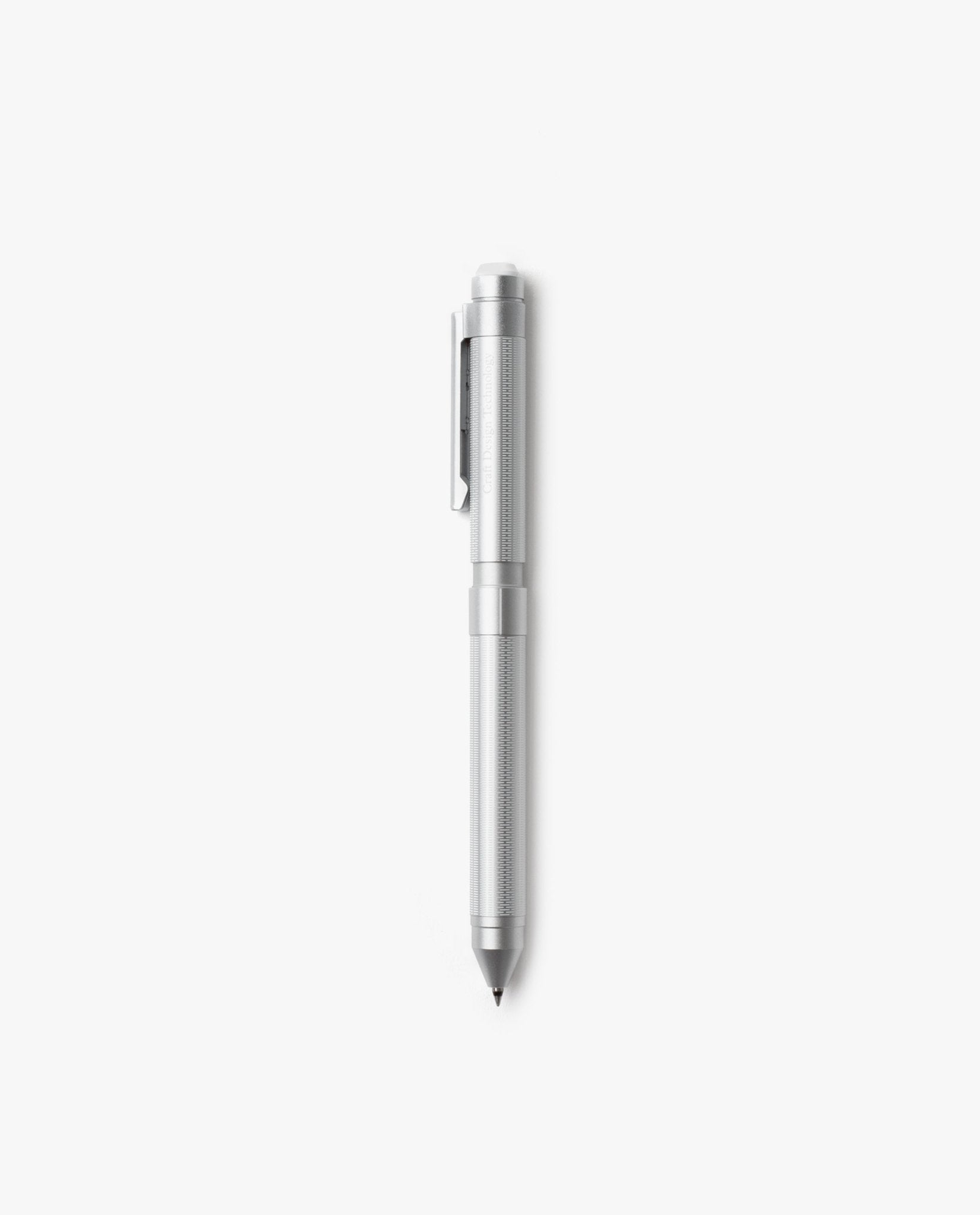 The Craft Design Technology Multifunctional Pen, featuring a silver finish, textured grip, and pocket clip, stands vertically against a plain white background.
