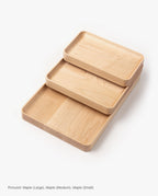 The Valet Tray Bundle (Maple - Set of 3) features handcrafted maple trays in large, medium, and small sizes, neatly stacked on a white background.
