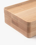 A close-up of two stacked Valet Tray (Maple - Medium) pieces with rounded corners, smooth edges, and visible maple grain, highlighting handcrafted joinery on a white background.