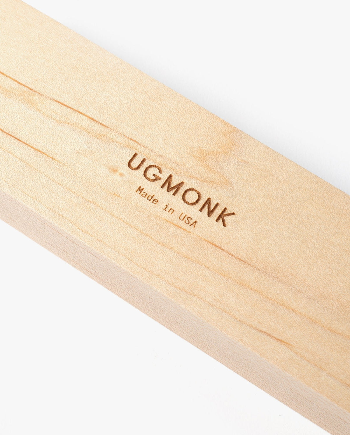 A close-up of the Pen Tray (Maple), crafted from solid maple wood and engraved with "UGMONK Made in USA," made in Pennsylvania, shown on a white background.
