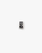 The Ugmonk Enamel Pin is a small, rectangular metallic accessory featuring a minimalist design with geometric U and M shapes on a plain white background.