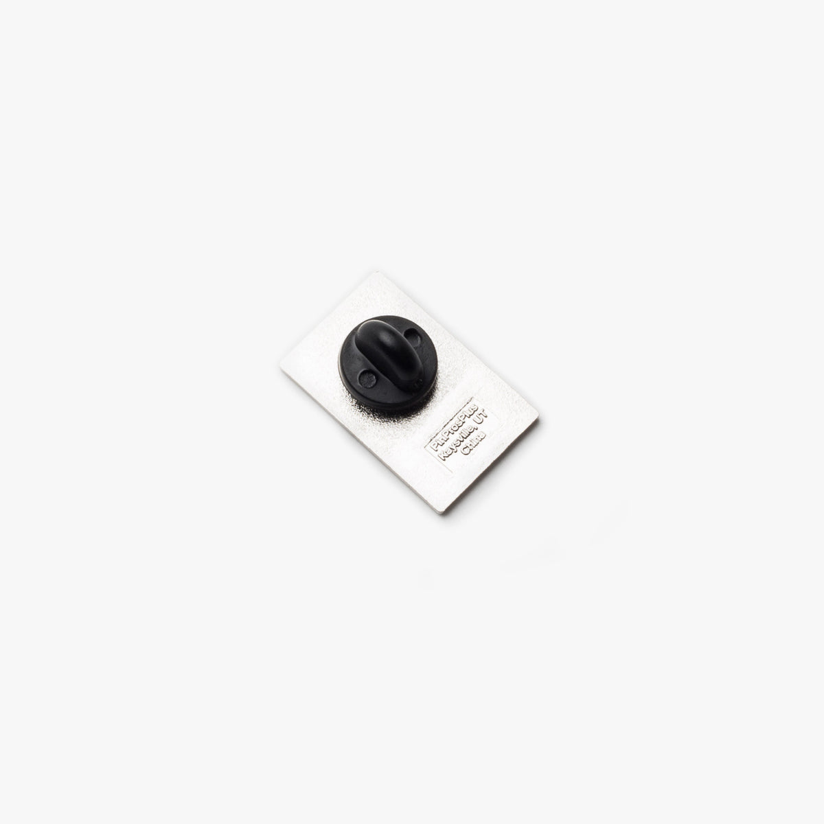A Ugmonk Enamel Pin with a rectangular shape and black rubber clutch backing is centered on a plain white background.