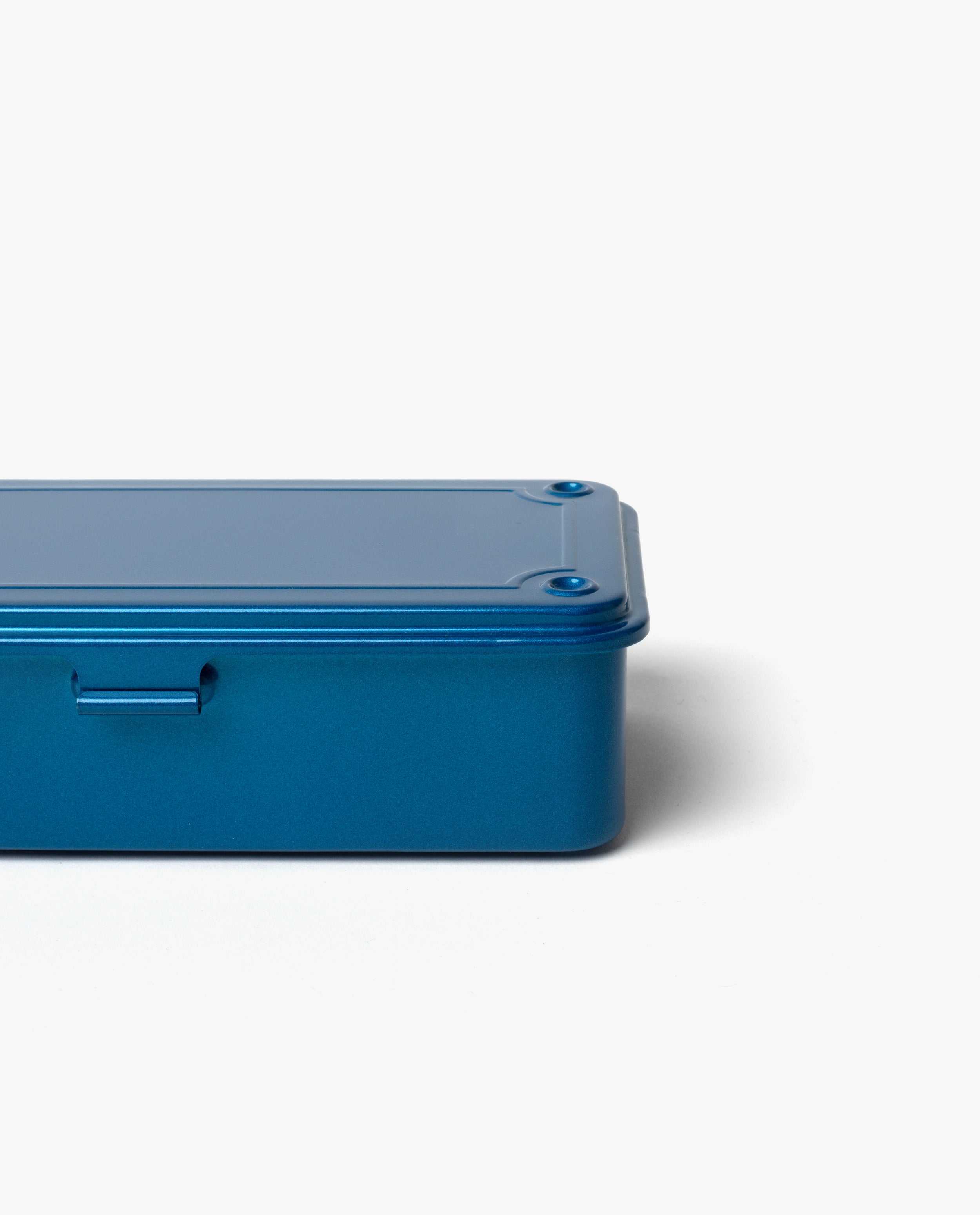 A Toyo Steel Stackable Storage Box T-190 in blue, made in Japan, is displayed against a white background with only the right side of the rectangular metal box visible.