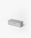 The Toyo Steel Stackable Storage Box T-190 (Silver) is a rectangular metal box with a hinged lid and latch, made in Japan. Shown here on a plain white background, it’s designed for easy stacking and durable storage.