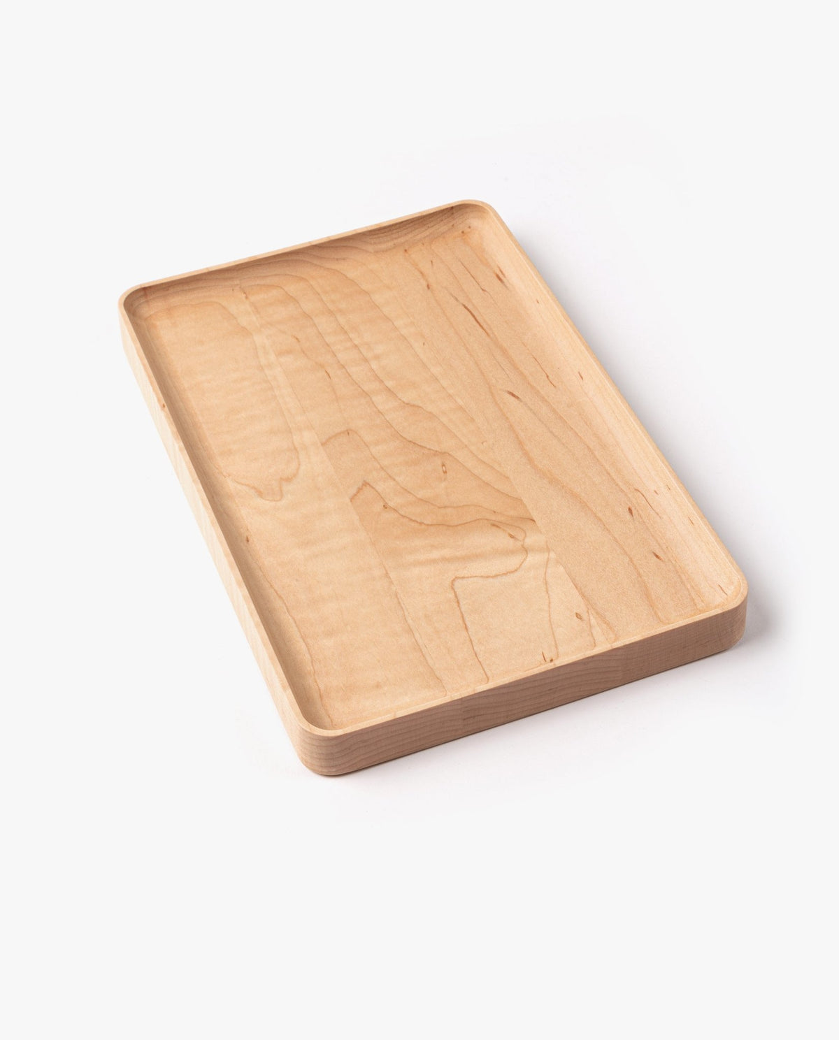 A large rectangular valet tray, handcrafted from solid maple with a smooth, light wood grain finish and slightly raised edges, is shown on a white background.