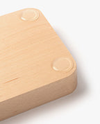 A close-up of the Valet Tray (Maple - Small), a handcrafted solid maple wooden block with rounded edges and two clear rubber pads on the bottom, designed in a minimalist style and displayed on a white background.