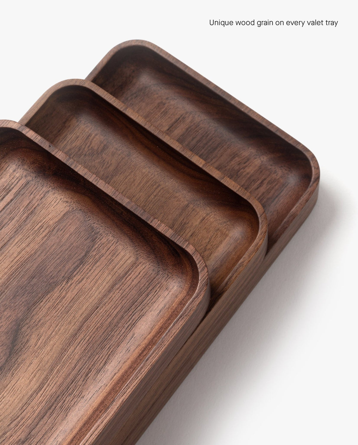 The Valet Tray (Walnut - Small) features a smooth finish and unique wood grain, handcrafted in Pennsylvania—ideal for storing everyday carry items. Each tray is one-of-a-kind due to natural walnut variations.