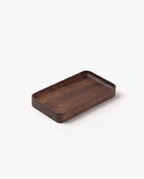 The Valet Tray (Walnut - Small) is a handcrafted rectangular walnut tray with rounded edges and a smooth finish, made in Pennsylvania for everyday carry storage. Shown on a white background.