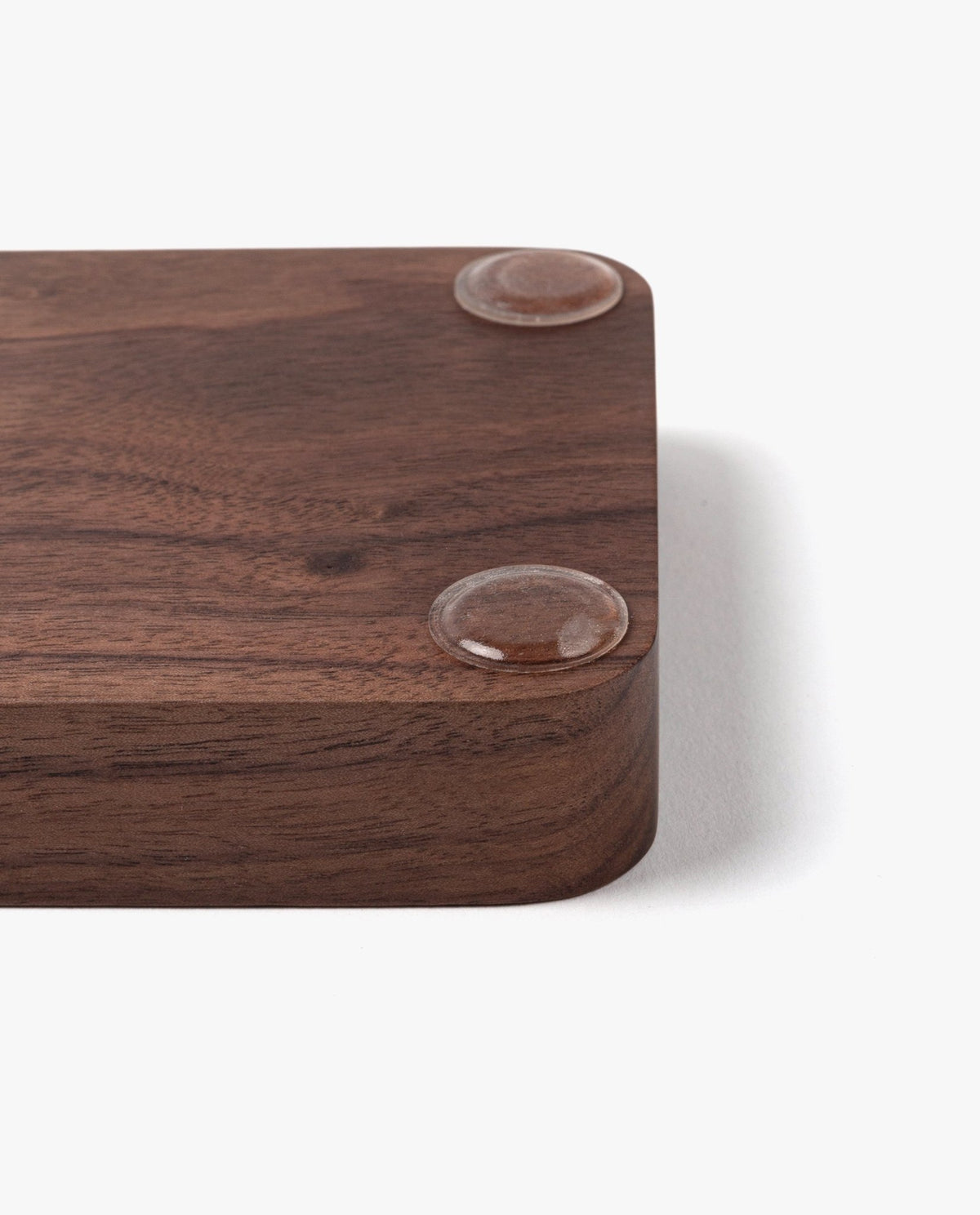 A close-up of the Valet Tray (Walnut - Small), a handcrafted rectangular walnut tray with rounded corners and two clear rubber pads, made in Pennsylvania—perfect for organizing your everyday essentials.